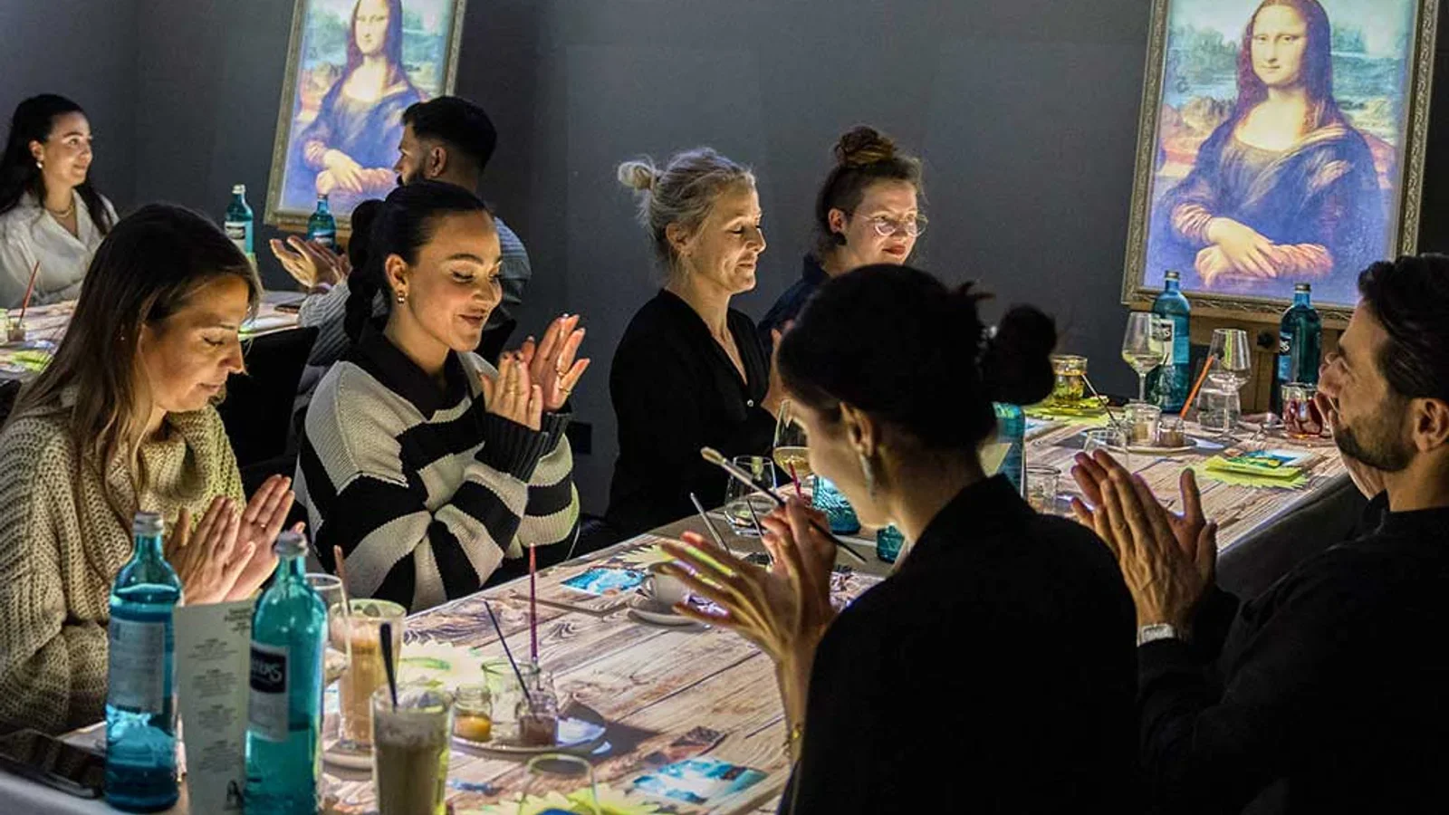 Seven Paintings immersive dining show with projection-mapped tables