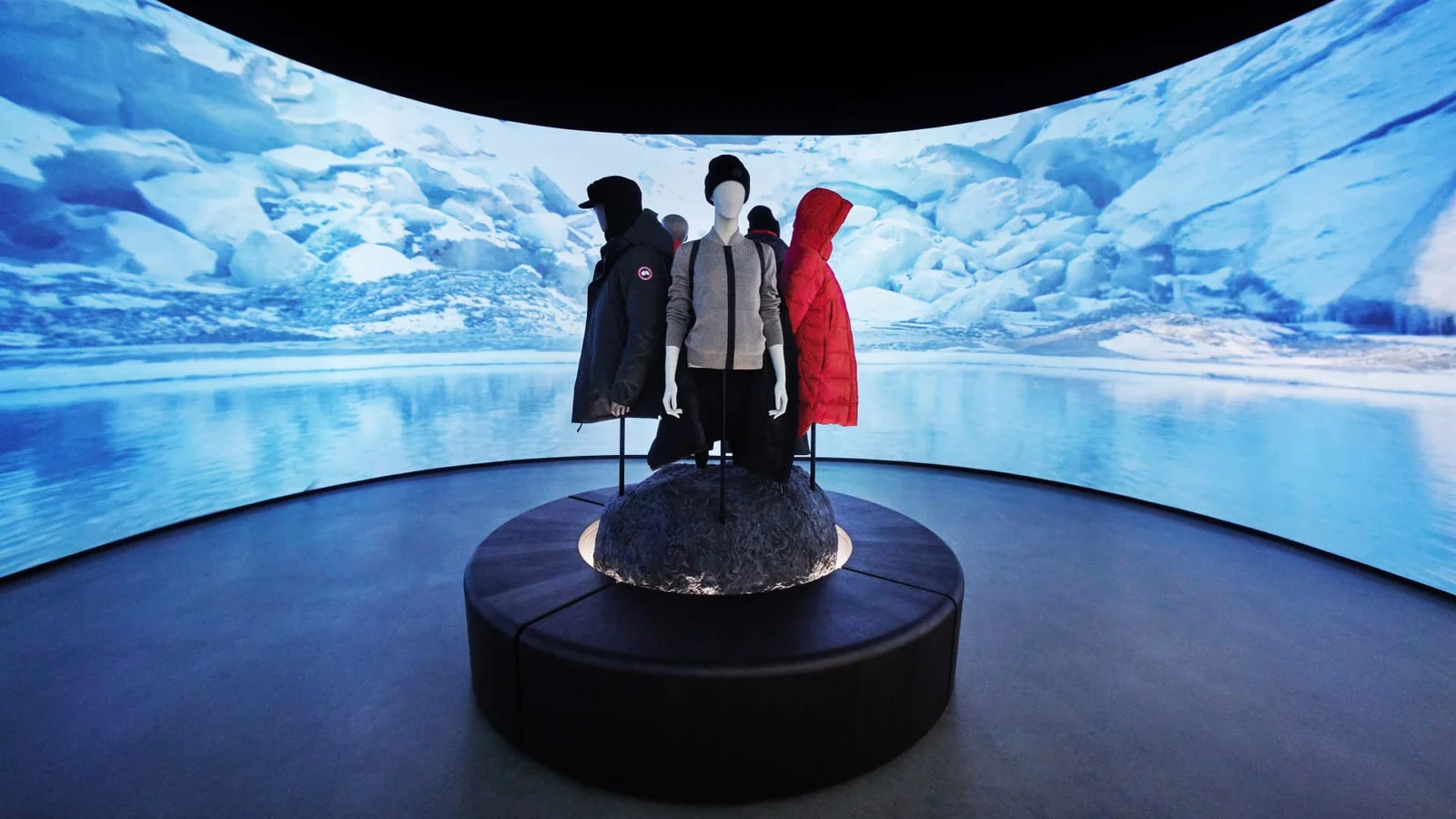 Canada Goose parkas displayed on a plinth against a panoramic Arctic screen in the Cold Room concept store