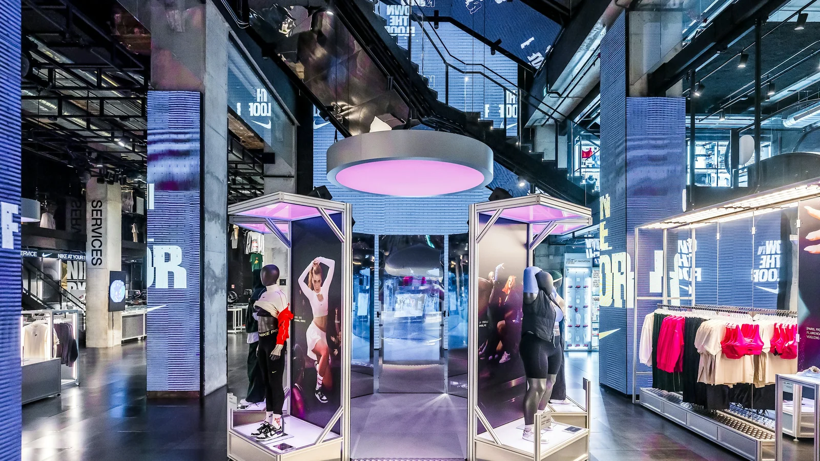 Nike House of Innovation Paris interior with illuminated interactive pods on the shop floor