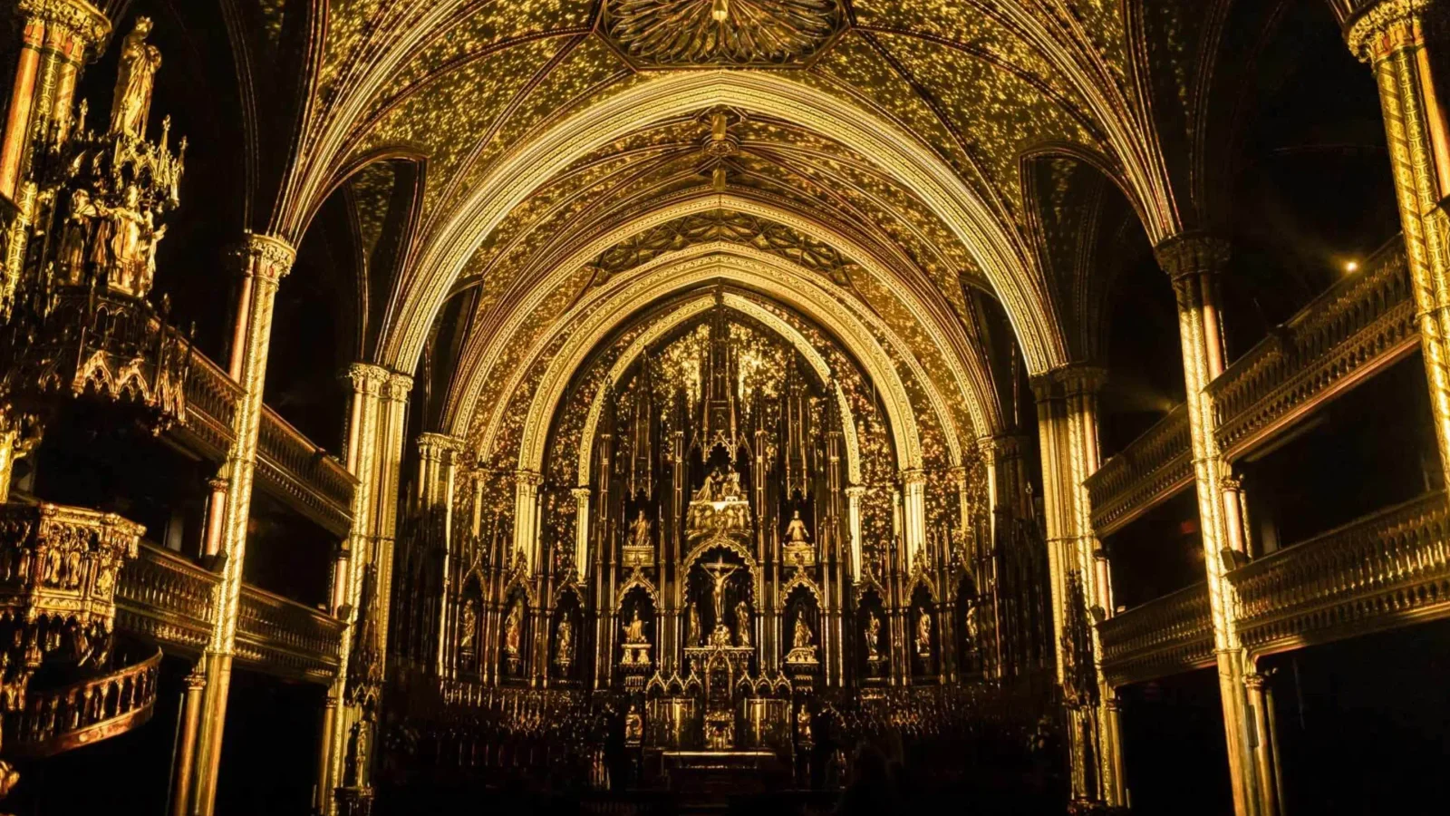 AURA by Moment Factory at Notre-Dame Basilica Montreal — projection mapping transforms the golden interior into a luminous experience